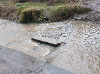 Photograph showing the manhole cover for the inlet to the South Inch Pond in the Craigie Burn after the clearance works